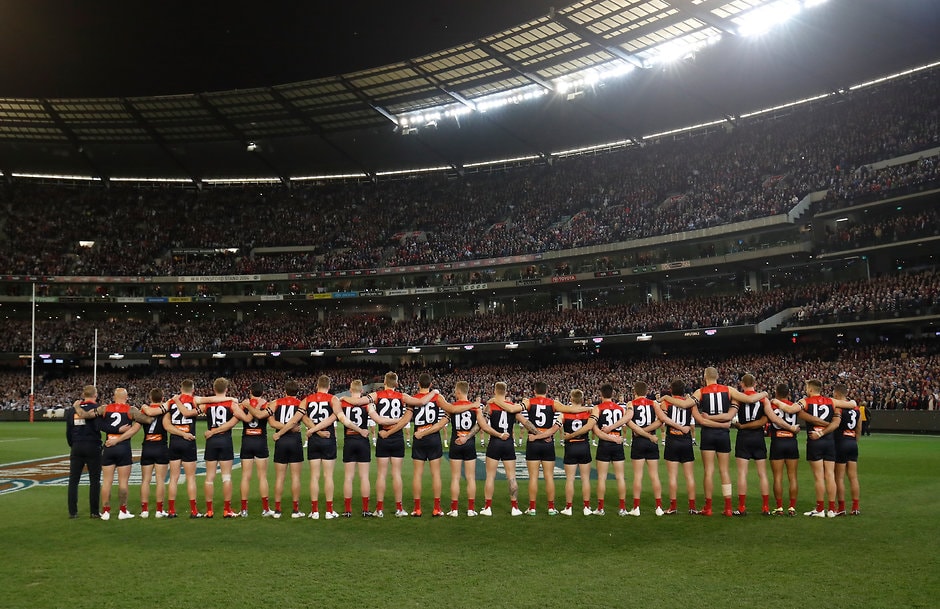 AFL 2018 First Elimination Final - Melbourne v Geelong MELBOURNE, AUSTRALIA - SEPTEMBER 07: Demons players line up for the national anthem during the 2018 AFL First Elimination Final match between the Melbourne Demons and the Geelong Cats at the Melbourne Cricket Ground on September 07, 2018 in Melbourne, Australia. (Photo by Adam Trafford/AFL Media)